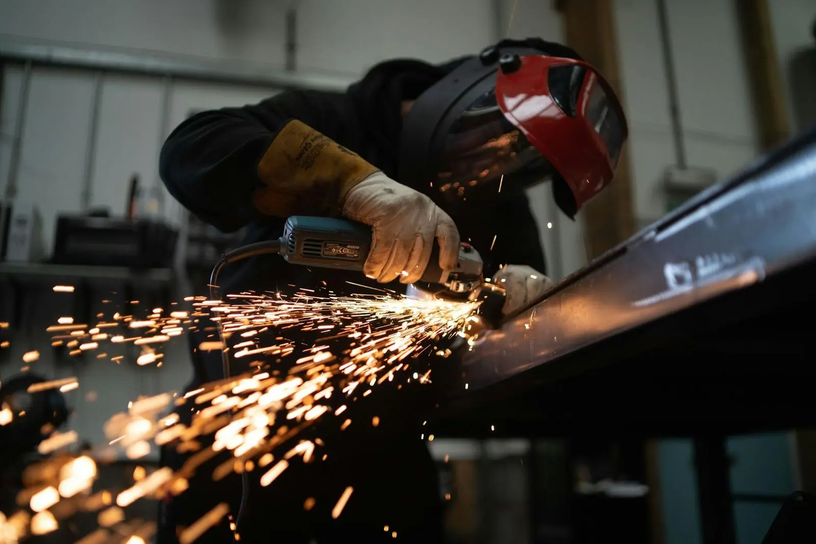 Grinding a steel part with sparks